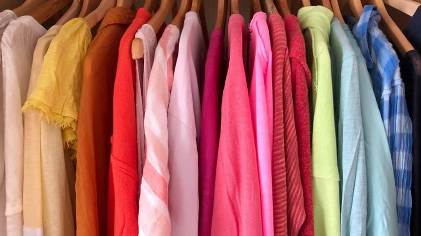 Coloured clothes on rack